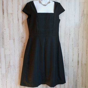 Classic black sheath dress with cap sleeves